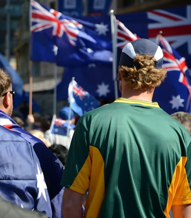 A crowd waving Australian flags